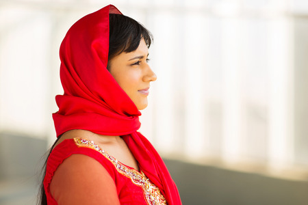 thoughtful young indian businesswoman in traditional clothes