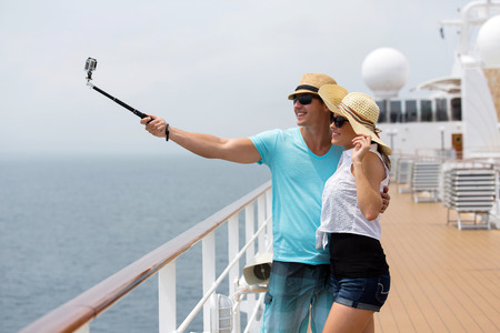 adorable couple taking self portrait on cruiseの写真素材