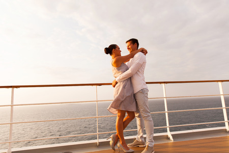 full length portrait of lovely couple hugging on cruiseの写真素材