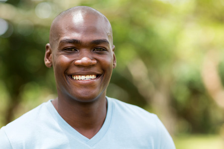close up portrait of young african american man outdoorsの写真素材