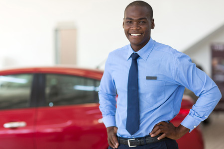 african american vehicle sales consultant inside showroomの写真素材