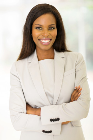cheerful african entrepreneur with arms crossedの写真素材