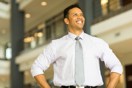joyful middle aged business man daydreamingの写真素材
