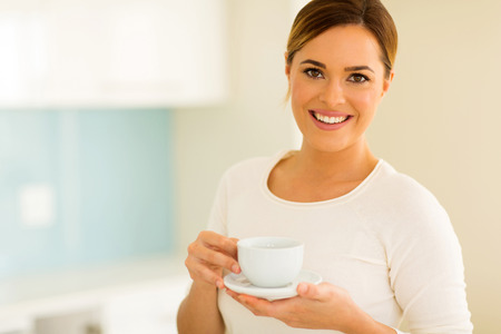 portrait of woman drinking tea at homeの写真素材