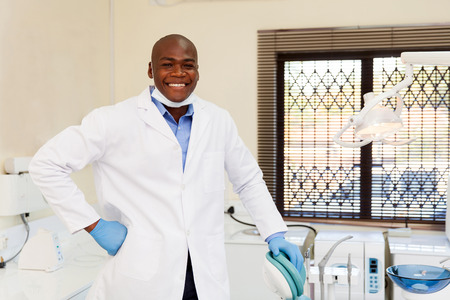 happy african american dentist in officeの写真素材