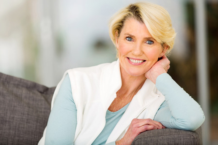 portrait of beautiful senior woman sitting indoorsの写真素材