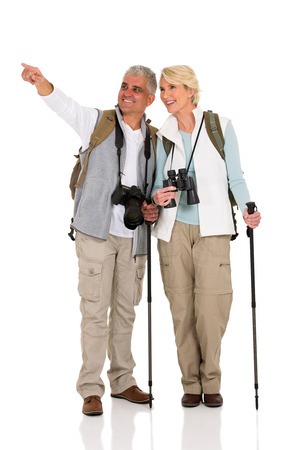 happy couple sightseeing and pointing directionの写真素材