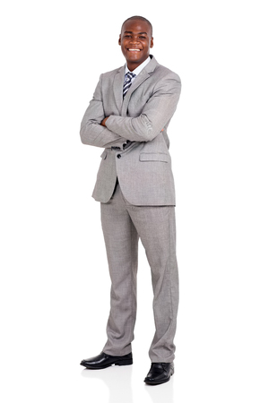 handsome young african american businessman with arms foldedの写真素材