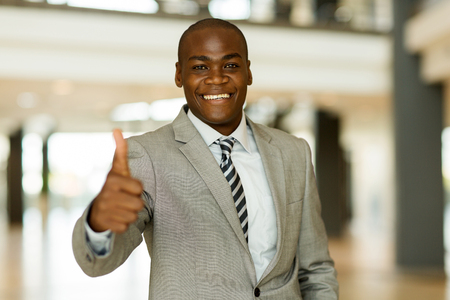 confident afro american business man thumb upの写真素材