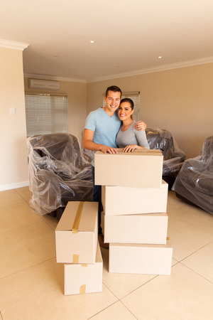 happy married couple moving in new houseの写真素材