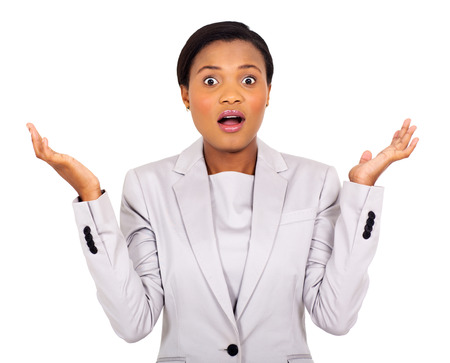 portrait of surprised young african businesswoman on white backgroundの写真素材