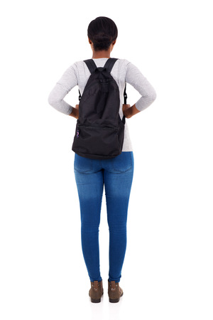 rear view of african female college student isolated on white backgroundの写真素材