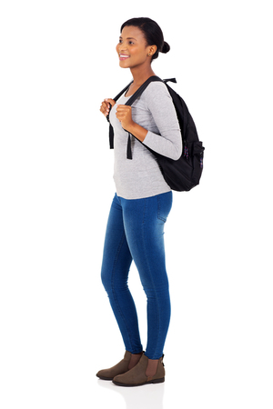 side view of african female college student isolated on white backgroundの写真素材