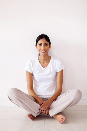 portrait of pretty indian woman relaxing at homeの写真素材
