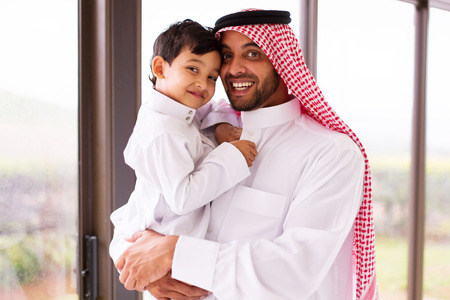 happy muslim father and son indoorsの写真素材