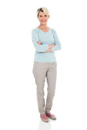 happy senior woman arms crossed isolated on whiteの写真素材