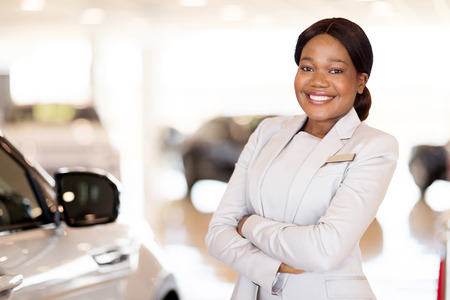 attractive young african vehicle saleswomanの写真素材