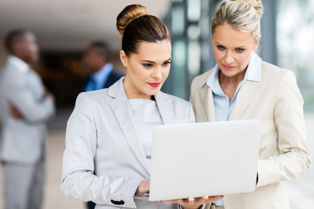 portrait of professional businesswomen working together on laptopの写真素材