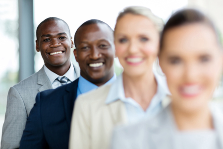 group of happy business executives standing in a rowの写真素材