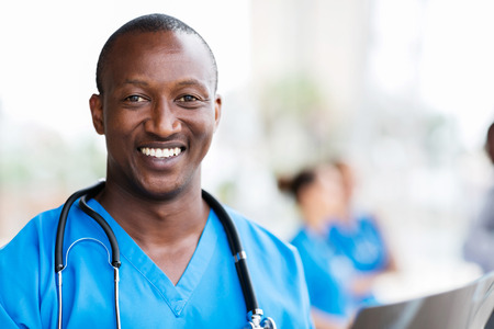 smiling african medical professional with stethoscopeの写真素材