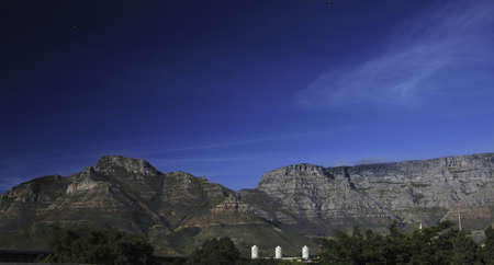 Table Mountain and Devil's Peak view with Cape Town buildingsの写真素材