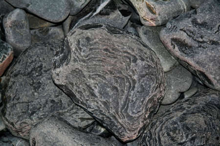 Stones laying down on the seashore.の写真素材