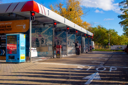 Car wash station with multiple bays and clear blue sky on a sunny dayのeditorial素材