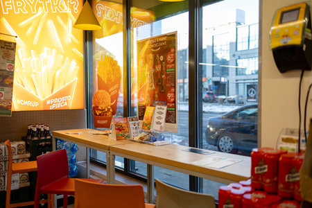 Snacks and drinks are available inside a fast food restaurant in winter