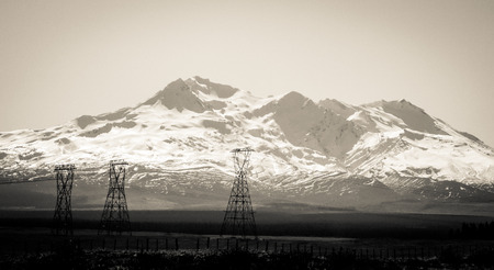 Black & White Snowy Tongariro Mountain Scene with Pylons & Fields in Foregroundの写真素材