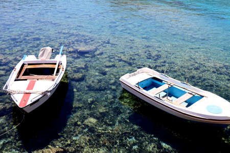 Two rowboats anchoring on the coastの写真素材