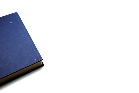 Blue antique book on a white background - close up - corner of a book