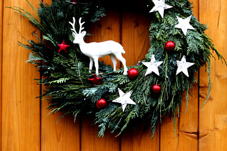 Close up of Christmas wreath on a wooden board backgroundの写真素材