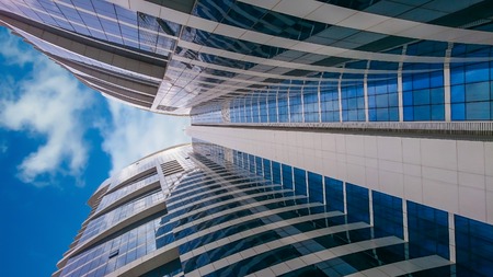 Skyscrapers. tall buildings seen from the ground up towards the sky.のeditorial素材