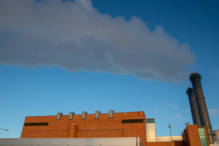 Smoke exiting two chimneys is winterのeditorial素材