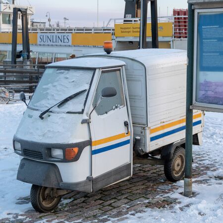 FINLAND, HELSINKI - JANUARY 2015: traditional vintage vehicle with three weels, parked next to...
