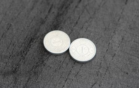 close up of 10 (ten) cent Netherlands Antillean guilder coin on black background