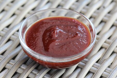 close up of Smoked red bbq sauce in glass bowlの写真素材