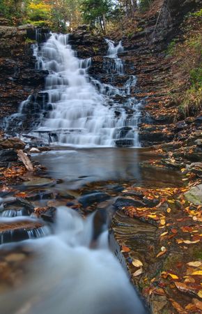 F.L. Ricketts Falls, Ricketts Glen State Park, viewed from Kitchen Creek in early Autumn.の写真素材