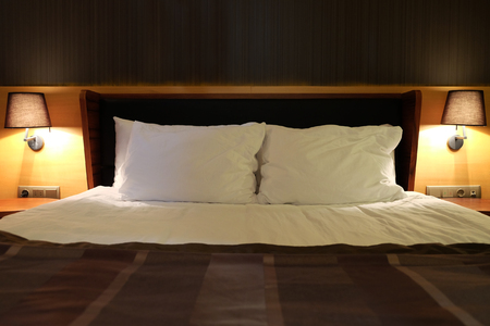 Bed set in a bedroomの写真素材