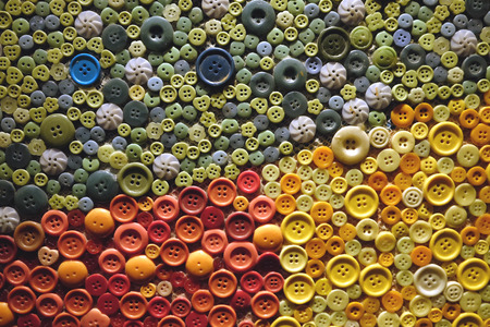 Colorful studs sorted in a pattern texture of green red and yellow colorの写真素材