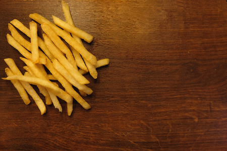 French fries or chips on the wooden plateの写真素材