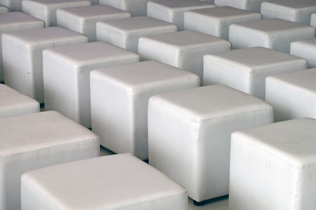 Rows of white box shape chairsの写真素材