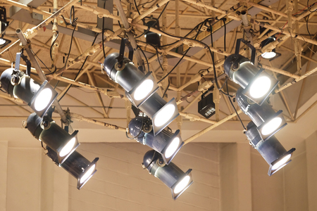 Spotlights installed on structured ceiling shining the light