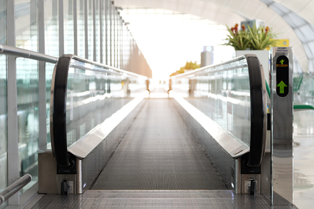 Green sign to allow using straight direction escalator for saving energy of walking in the very big airportのeditorial素材