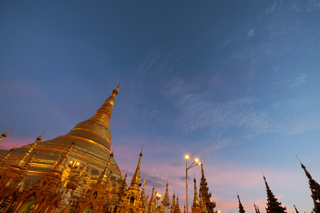 Schwedagon pagoda in twilight with some cloudy in the skyの写真素材