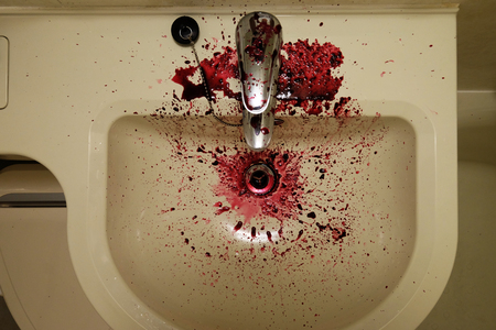 Top view of water sink stained by the red fruit juiceの写真素材