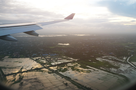 Perspective of flooding in rice field view from the window of airplane above the skyの写真素材