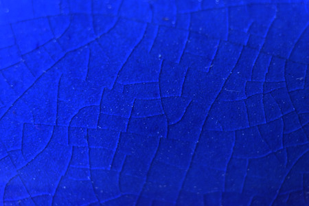 Vivid blue gradient on randomly cracked glass pattern wallの写真素材