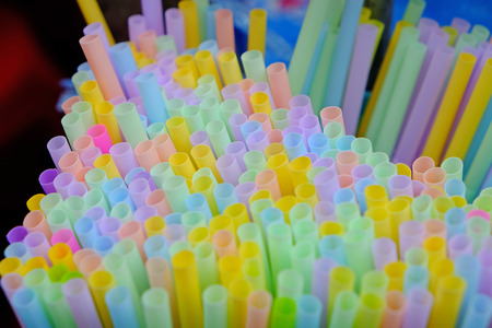 Top view and closeup of pastel colorful straws