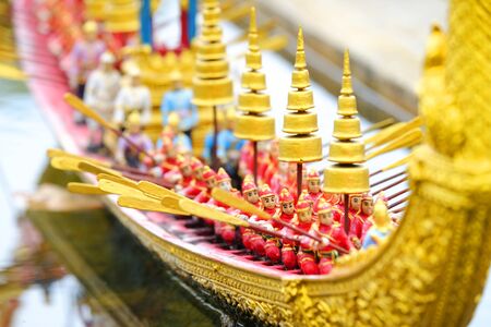 Closeup model of workers paddling a royal boatの写真素材